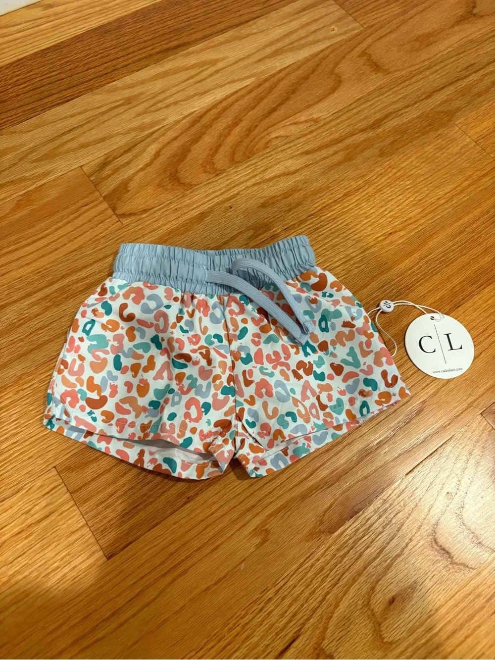 Caden Lane Coral & Teal Animal Print Swim Shorts